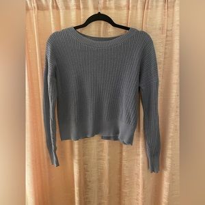 Blue light weight knitted sweater. In good condition.